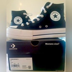 Young Woman’s High Top Converse